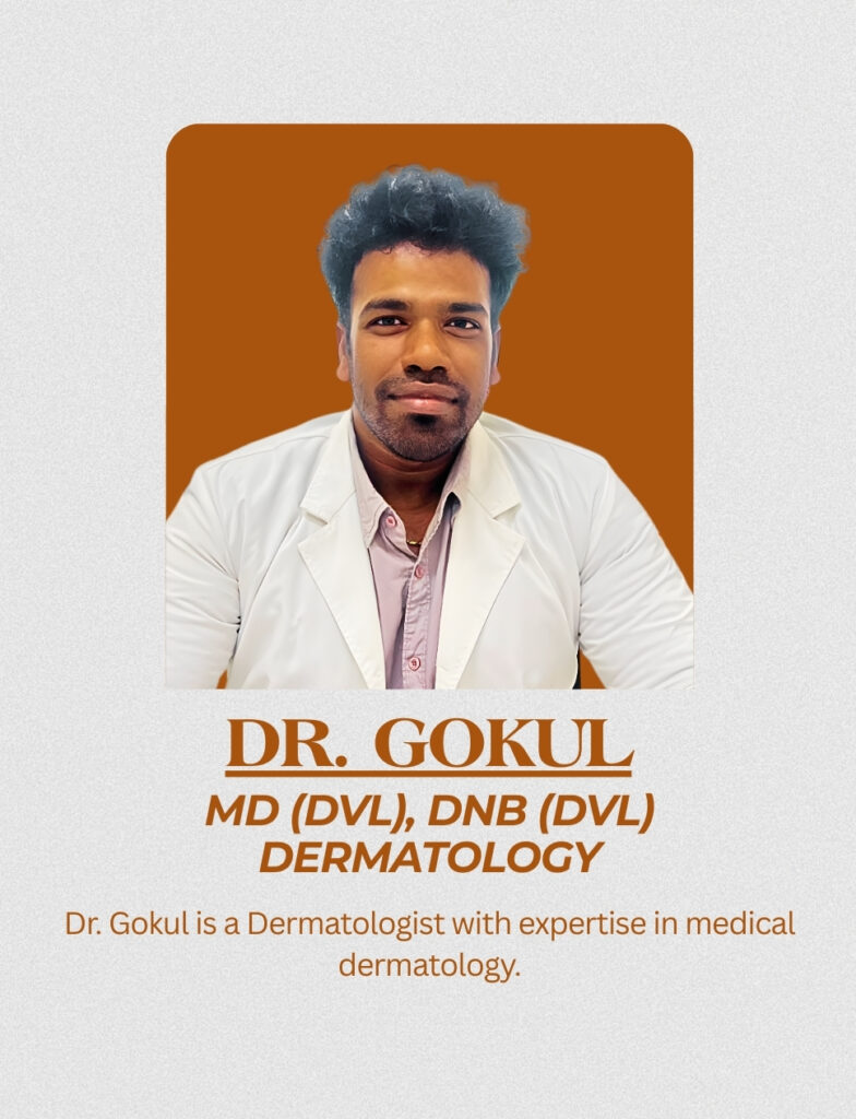 Dr. Gokul, Dermatologist, wearing a white coat and seated for a professional clinical portrait.